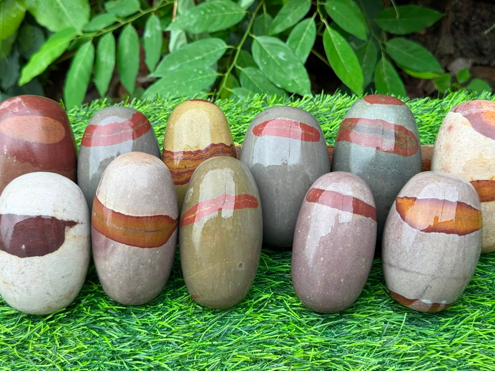 Multiple Narmadeshwar Shivlings showing variety of sizes and finishes